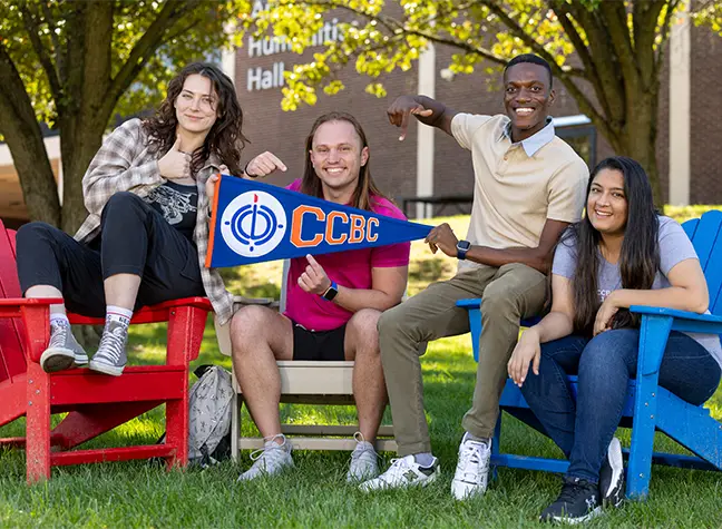 Group of Students talking outside, on campus.