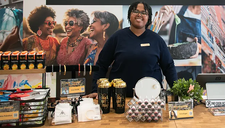 Women sell products behind a counter