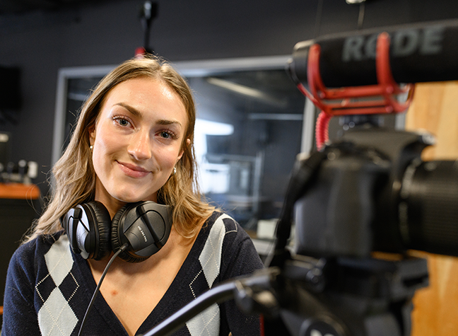 Student with video camera