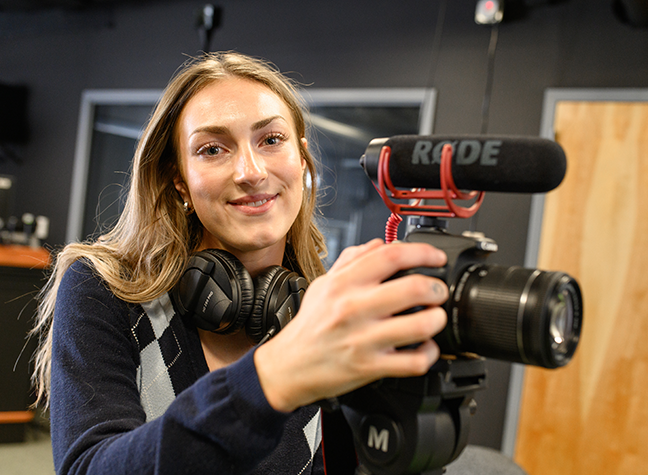 Meg holding a camera